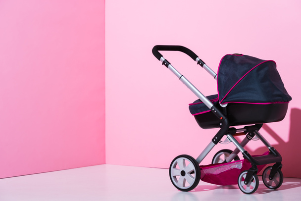 baby carriage on pink and white with copy space - Photo, Image