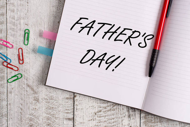 Conceptual hand writing showing Father S Day. Business photo text day of year where fathers are particularly honoured by children Notebook stationary placed above classic wooden backdrop. - Photo, Image