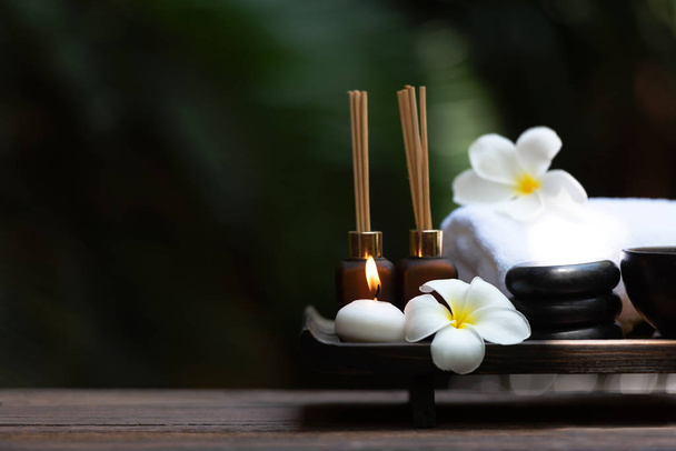 Thai Spa Treatments aroma therapy salt and sugar scrub and rock massage with frangipani plumeria flower with candle. Thailand. Healthy Concept. copy space - Zdjęcie, obraz
