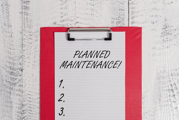 Text sign showing Planned Maintenance. Conceptual photo Check ups to be done Scheduled on a Regular Basis Colored clipboard blank paper sheet old retro wooden vintage background. - Photo, Image