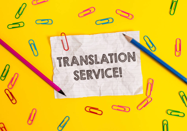 Conceptual hand writing showing Translation Service. Business photo showcasing the Equivalent Target Language from the Mother Tongue Blank crushed paper sheet message pencils colored background. - Photo, Image