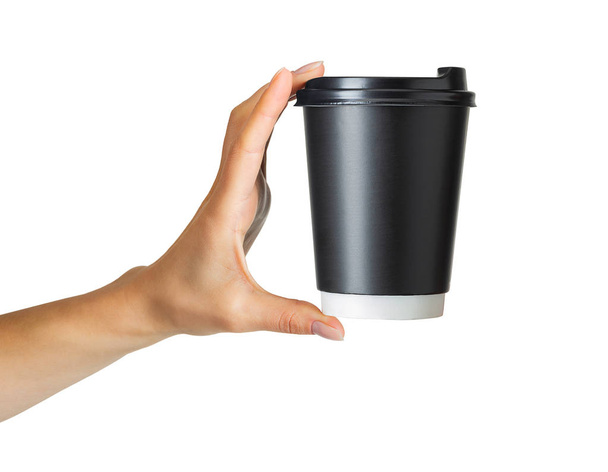 Woman hand holding coffee paper drinking cup - Fotoğraf, Görsel