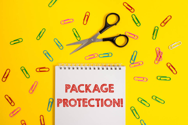 Word writing text Package Protection. Business concept for Wrapping and Securing items to avoid damage Labeled Box Blank no color spiral notepad scissors clips colored background design. - Photo, Image