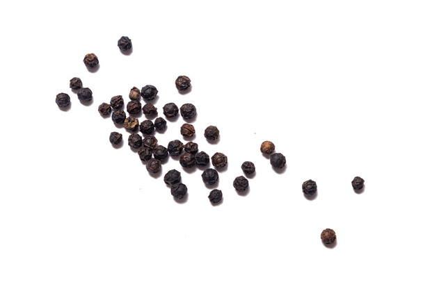 Black pepper, peppercorn, isolated - Фото, изображение