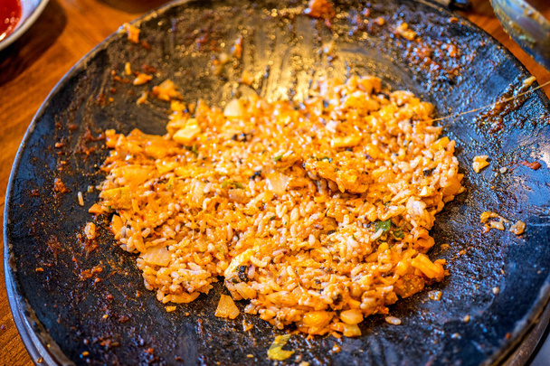 Delicious volcanic shaped fried rice with egg and spicy sauce, pork and squid, famous south korean food in jeju island restaurant, close up - Фото, зображення