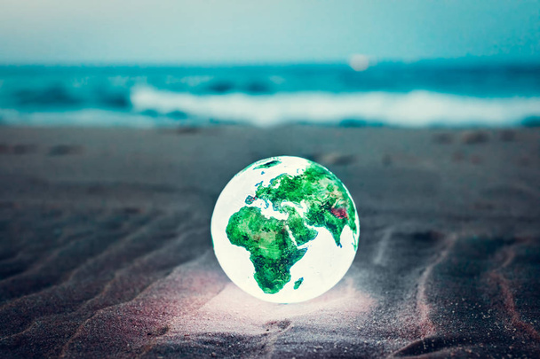 Globo da Terra na praia, conceito de proteção ambiental
 - Foto, Imagem