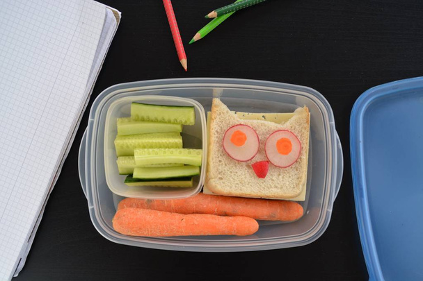 A break bread box full of vegetables and an owl toast - Photo, Image