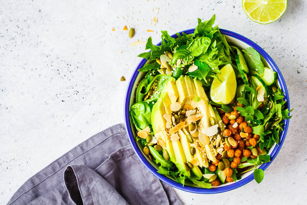 Green healthy salad with avocado, baked chickpeas and seeds  - Fotografie, Obrázek