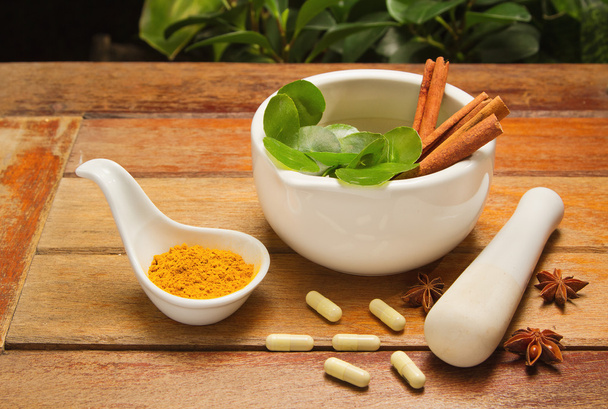 mortar and pestle with herb and pills - Photo, Image