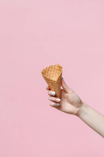 Waffle cone in female hand. - 写真・画像