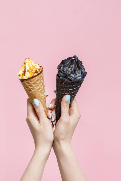 Woman holding Ice Cream in a waffles cones on color background. - Фото, изображение