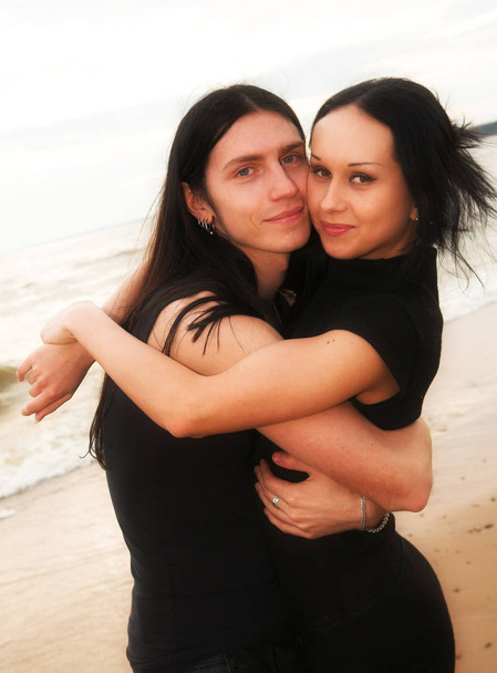 Loving couple near the sea - Фото, изображение