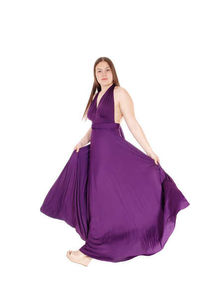 Teenager girl standing in her long burgundy prom dress - Photo, image