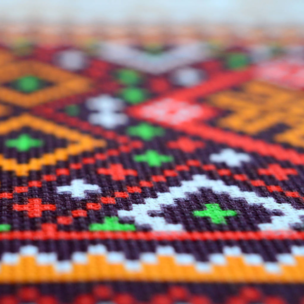 Traditional Ukrainian folk art knitted embroidery pattern on textile fabric - Photo, Image