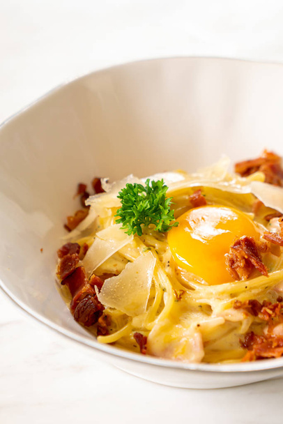 carbonara spaghetti with egg and cheese - 写真・画像