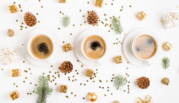 Creative natural layout of Christmas decorations with cups of coffee on a white background. Flat lay, Top view - Photo, Image