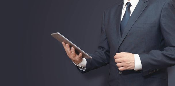 Man with digital tablet in hand. Copy space banner - Photo, image