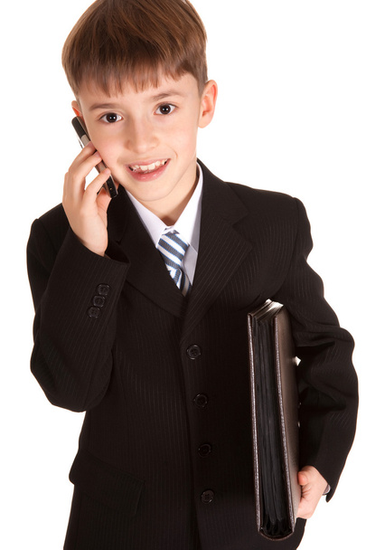 Young boy dressed as businessman - 写真・画像