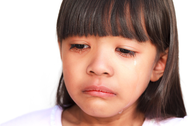 Little girl crying with tears rolling down her cheeks - Фото, зображення