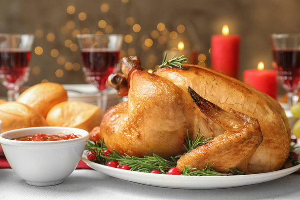 Traditional festive dinner with delicious roasted turkey served on table - Fotografie, Obrázek