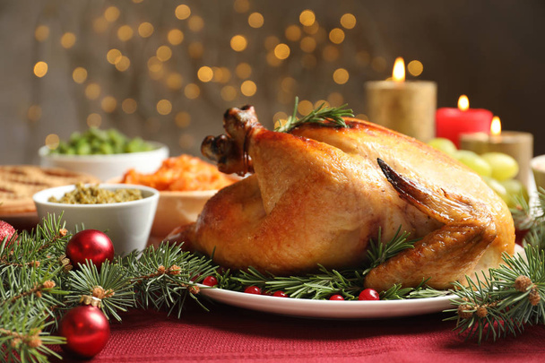 Traditional festive dinner with delicious roasted turkey served on table - Zdjęcie, obraz