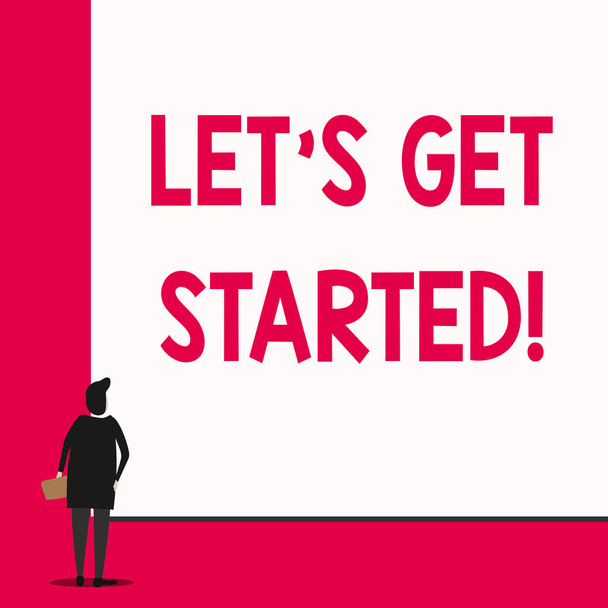 Conceptual hand writing showing Let S Get Started. Business photo text encouraging someone to begin doing something Man stands in back view in front of huge big rectangle board. - Photo, Image