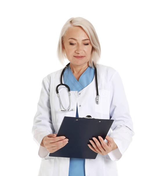Portrait of female doctor with clipboard isolated on white. Medical staff - Foto, Bild