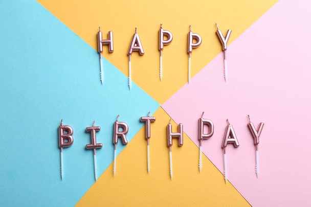 Flat lay composition with birthday candles on color background - Foto, immagini