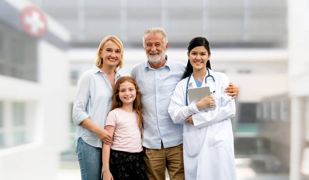 Doctor with happy family at hospital. - Photo, Image
