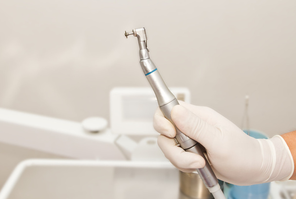 Dentist hand and dental tool in dental clinic - Photo, Image