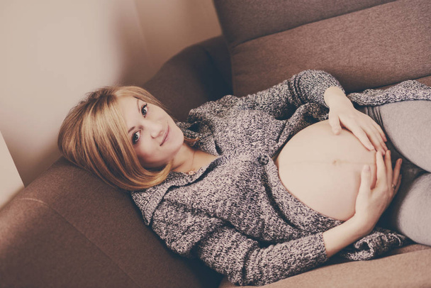 pregnant woman at home - Fotó, kép