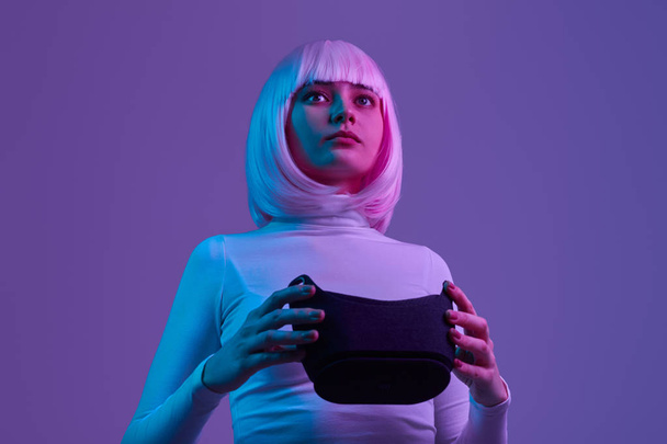 Futuristic female with VR helmet - Fotó, kép