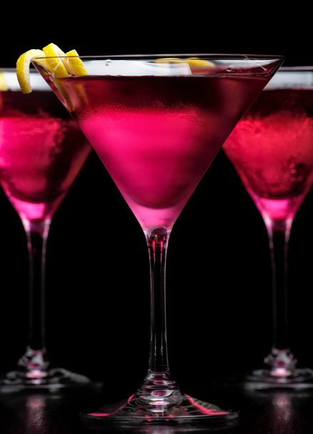 Closeup cosmopolitan cocktails isolated on black - Photo, Image