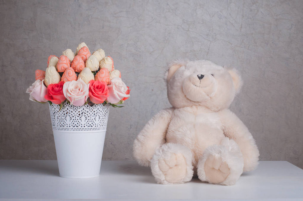 Fruit bouquet decoration with teddy bear toy on the table - Fotó, kép