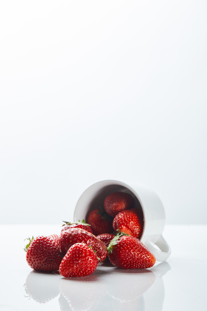 delicious organic strawberries in cup on white background - Foto, imagen