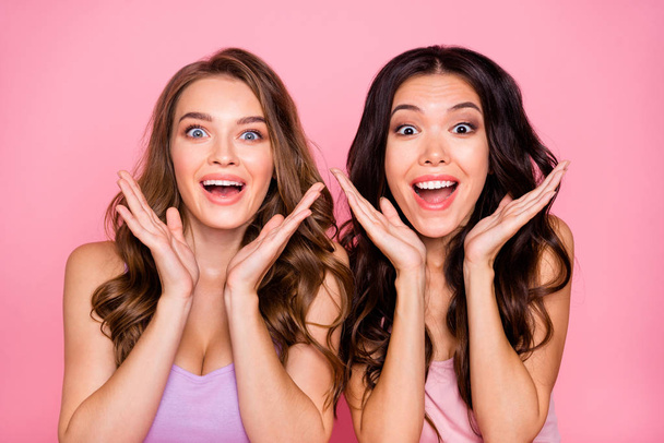 Close up photo funky cute charming ladies impressed astonished incredible bargain black friday reaction dressed modern youth clothing wavy curly haircut long stylish trendy isolated pink background - Photo, Image
