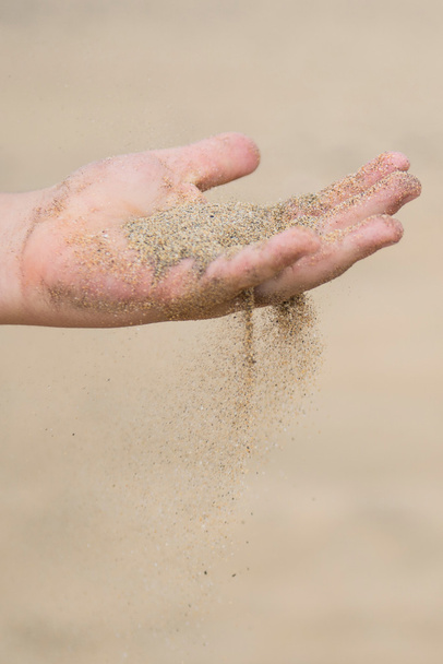 sand through your fingers - Photo, image