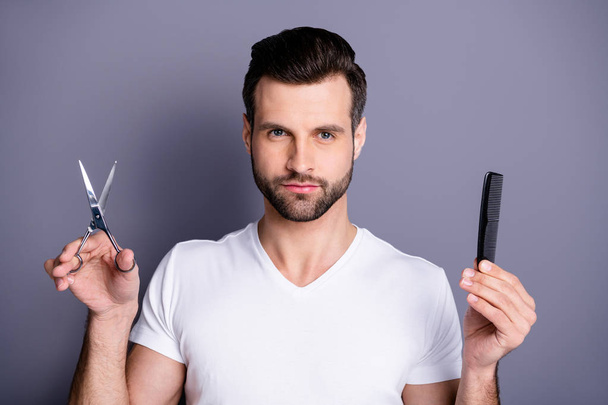 Close up photo amazing he him his macho barber shop stylist brush scissors hands look interested curious customer hairstyle ready make masterpiece wear casual white t-shirt isolated grey background - Photo, Image