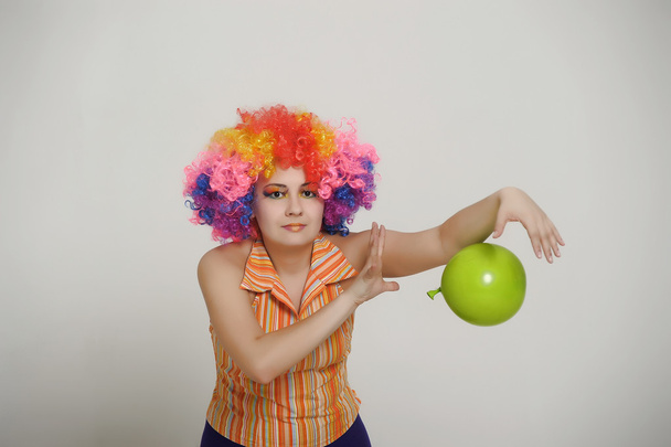 Girl with balloons in a colored wig - Valokuva, kuva