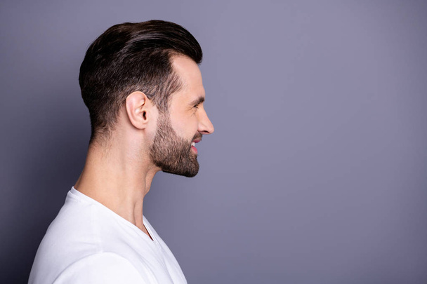 Close up side profile photo amazing he him his wondered funny macho perfect ideal appearance easy-going reliable person reveal teeth laughter wear casual white t-shirt isolated grey background - Fotoğraf, Görsel