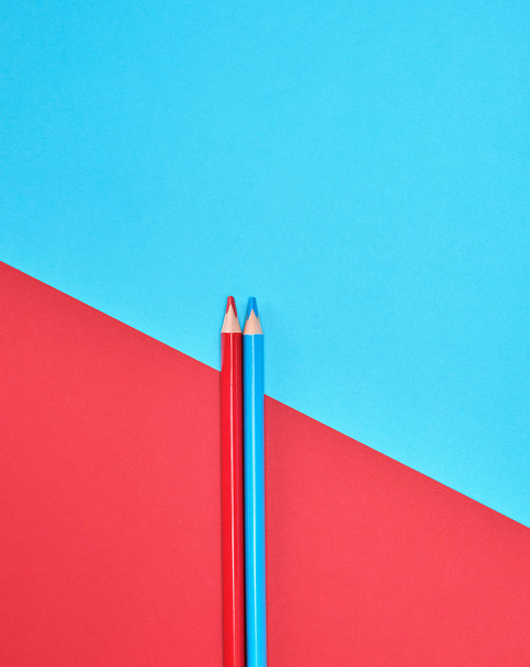 red and blue wooden pencils on color abstract background - Φωτογραφία, εικόνα