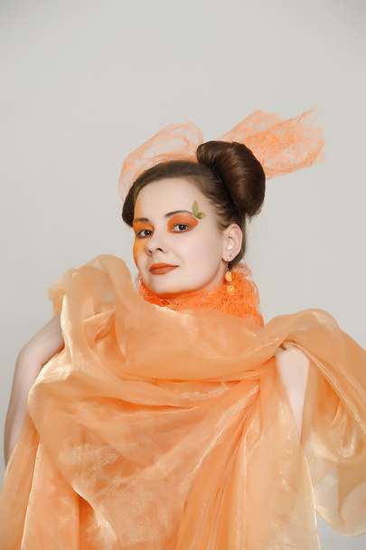Girl in an orange dress - Fotoğraf, Görsel