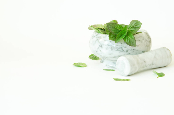 Fresh mint leafs in marble mortar bowl. - Image - Foto, Imagen
