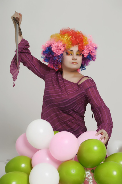 Girl with balloons in a colored wig - Фото, зображення