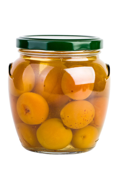 Glass jar with preserved apricots - 写真・画像