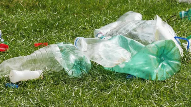 Plastic garbage on the grass. - Footage, Video