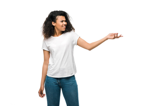 emotional african american curly woman gesturing isolated on white  - Φωτογραφία, εικόνα