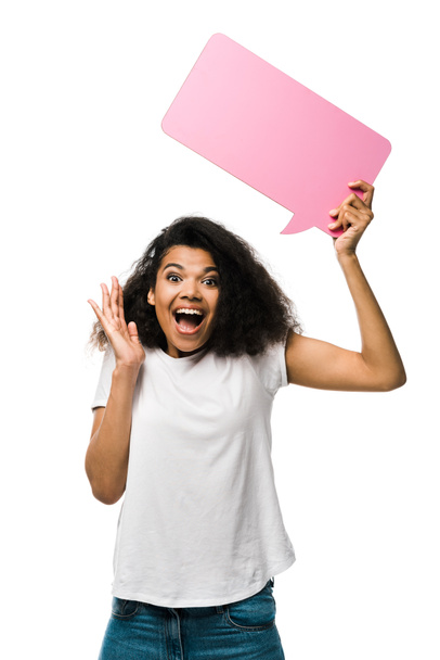happy african american girl holding pink speech bubble and gesturing isolated on white  - Φωτογραφία, εικόνα