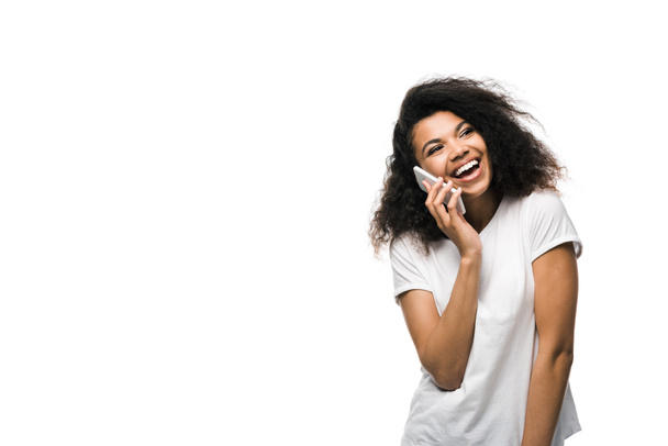 smiling african american girl talking on smartphone isolated on white  - Φωτογραφία, εικόνα