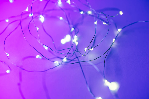 Background with led garland in trendy neon colors. - Фото, зображення